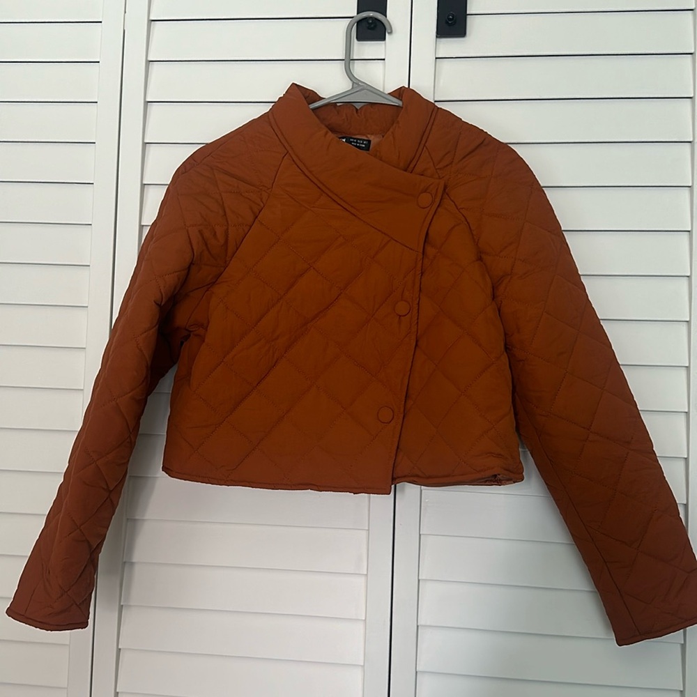 It’s a crop top jacket never worn. Brand new with no tags.